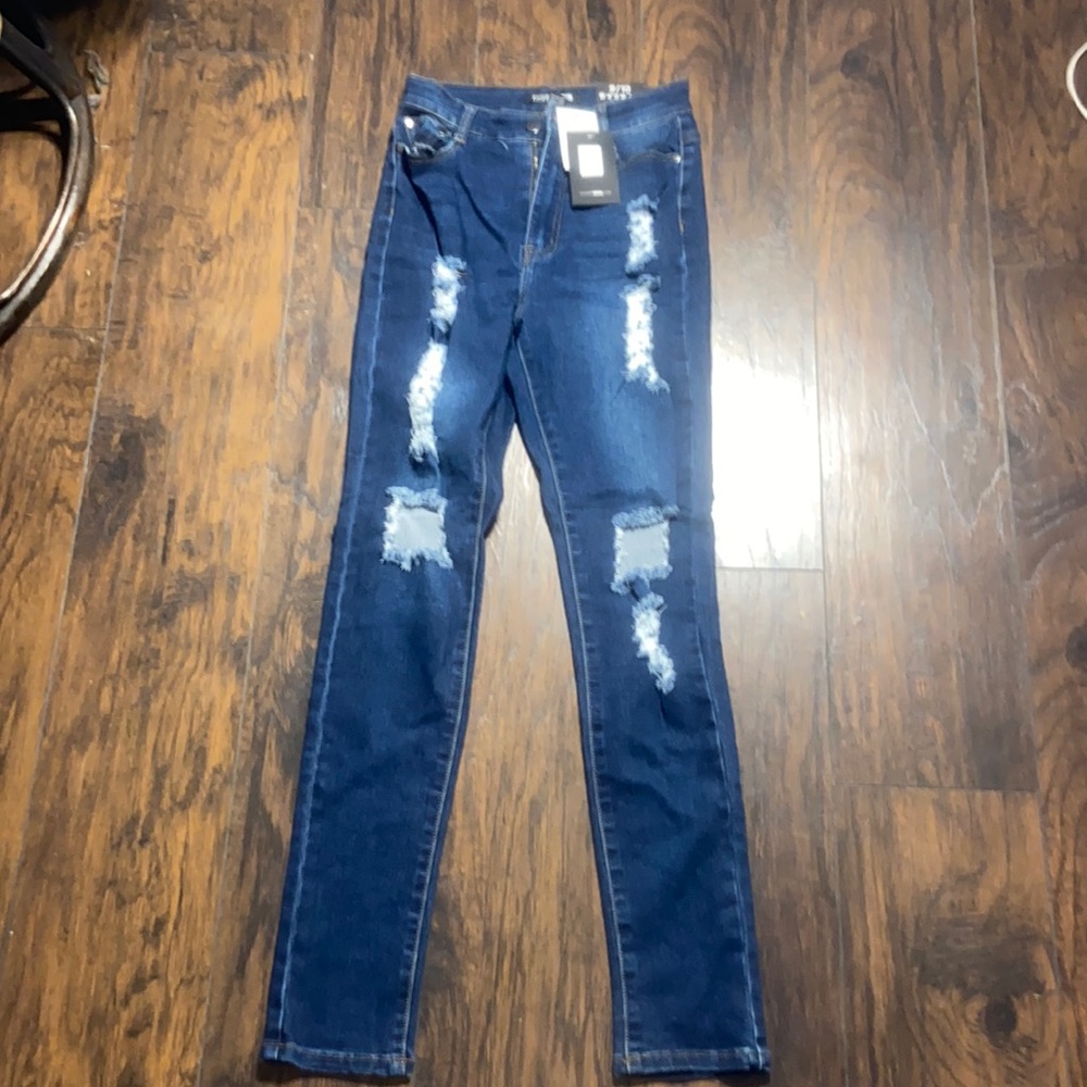 Ripped dark blue jeans